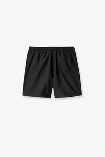 Back view of carhartt wip men’s black nylon swim trunks with elastic waistband and single back pocket