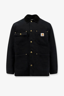 Black carhartt wip men’s og chore coat with gold-tone buttons and contrasting collar made from organic cotton