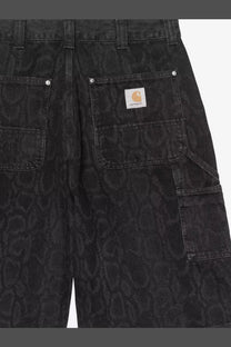 Back view of carhartt wip men’s og double knee black denim bermuda shorts with subtle snakeskin pattern and logo patch