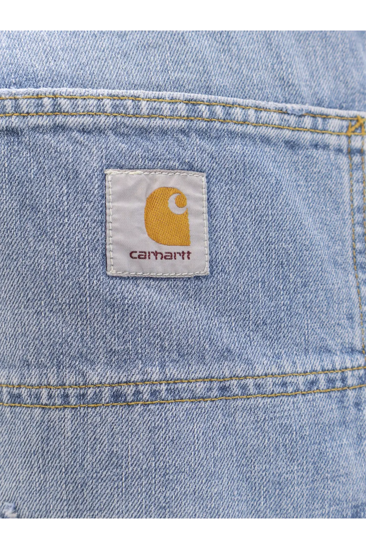 Light-wash denim jeans with classic carhartt patch blue men’s og double knee durable workwear style
