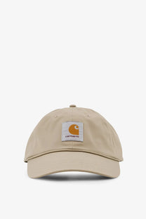 Beige Carhartt Wip men’s postal cotton blend baseball hat with white patch featuring orange logo and brand name