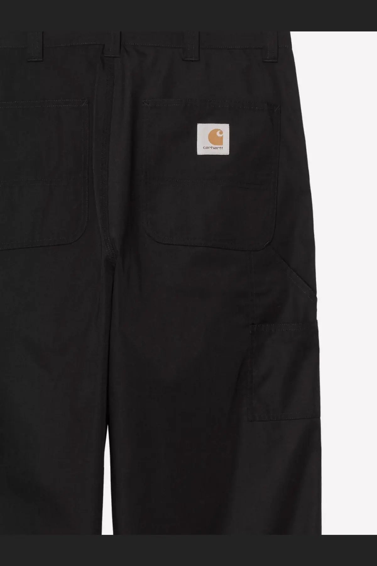 Back side of black carhartt wip men’s postal single knee cotton blend trousers with durable fabric and orange logo patch