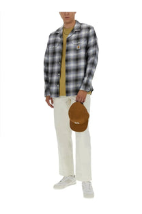 Tan corduroy baseball cap with small embroidered logo front featured with carhartt wip men’s multicolor shirt