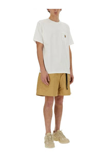 Carhartt Wip men’s white short-sleeved shirt with small chest pocket and subtle logo patch in cotton material