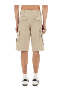 Carhartt Wip men’s beige cargo shorts with multiple pockets and durable fabric finish for rugged use
