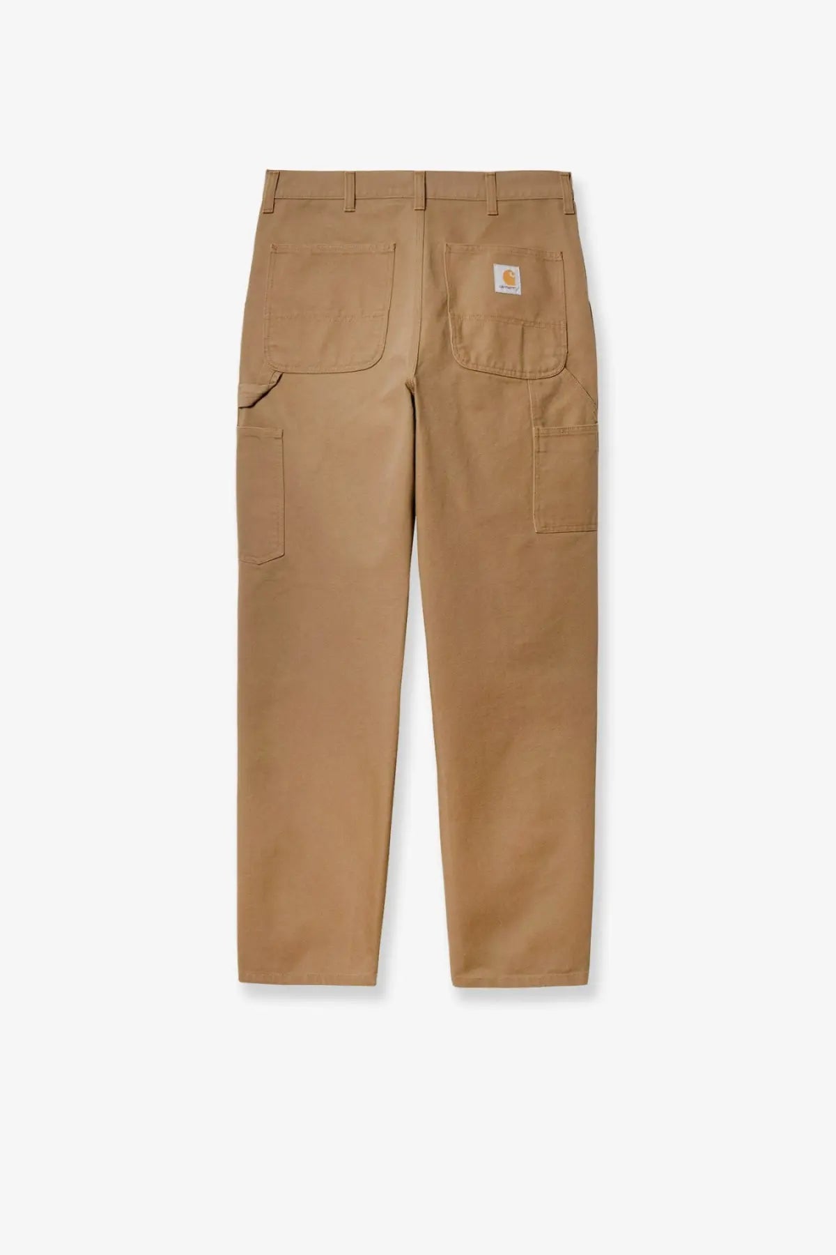 Back view of tan carhartt wip men’s single knee work pants with multiple pockets and branded patch on right pocket