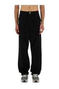 Black carhartt wip men’s single knee wide-leg trousers with gold-toned waistband button
