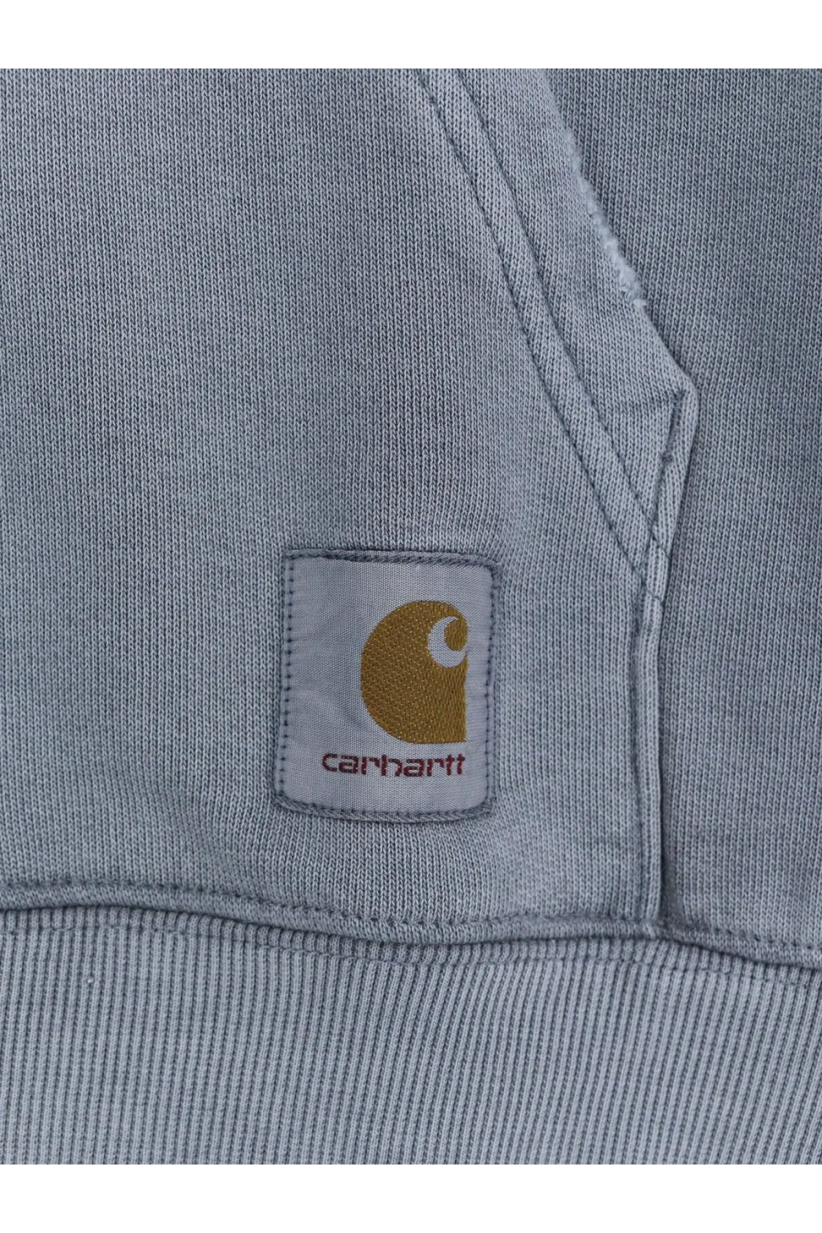 Gray carhartt sweatshirt with gold logo patch and red stitching made from cotton for casual wear