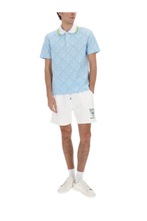 Casablanca men’s cotton polo shirt in light blue with white collar and lime green trim featuring a patterned design