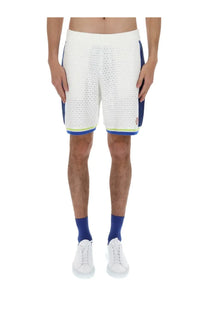 Casablanca men’s crochet shorts in white knitted fabric with blue side panels and neon yellow hem trim