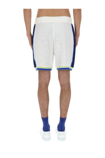 Casablanca men’s crochet shorts in white knit with blue side panels and neon green trim along the hem