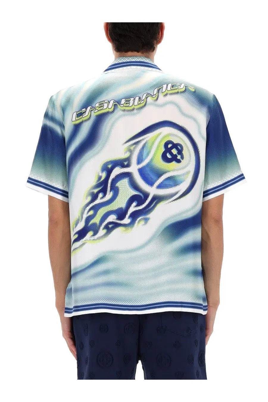 Blue and white graphic polo shirt with swirling flame design and casino lettering on the back for men