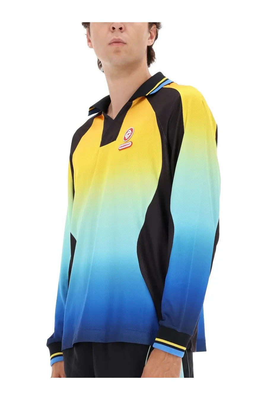 Casablanca men’s football shirt featuring a vibrant yellow to blue gradient long-sleeve polo with black accents and striped cuffs