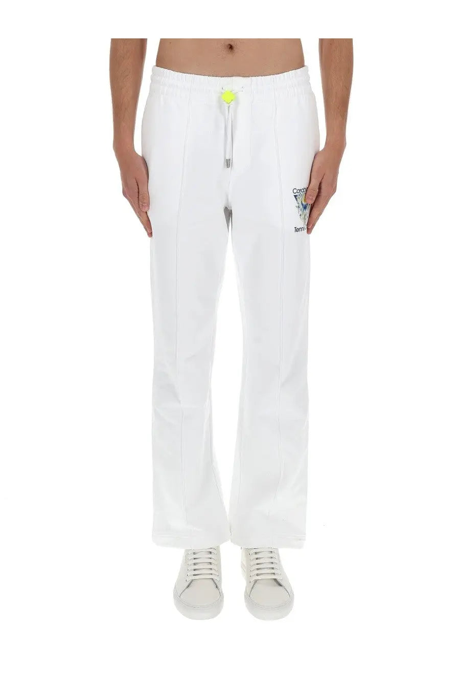 Casablanca men’s white cotton jogger pants with neon yellow drawstring tab and small embroidered logo on thigh