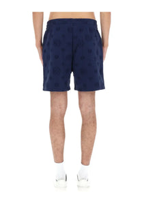 Dark blue casablanca men’s shorts with embossed circular logo pattern on fabric for stylish casual wear