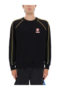 Casablanca men’s black crewneck sweatshirt with yellow piping and red circular logo patch on the chest