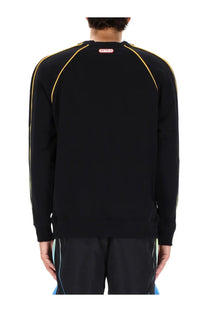 Casablanca men’s black sweatshirt with yellow piping on shoulders and sleeves and red label at neckline
