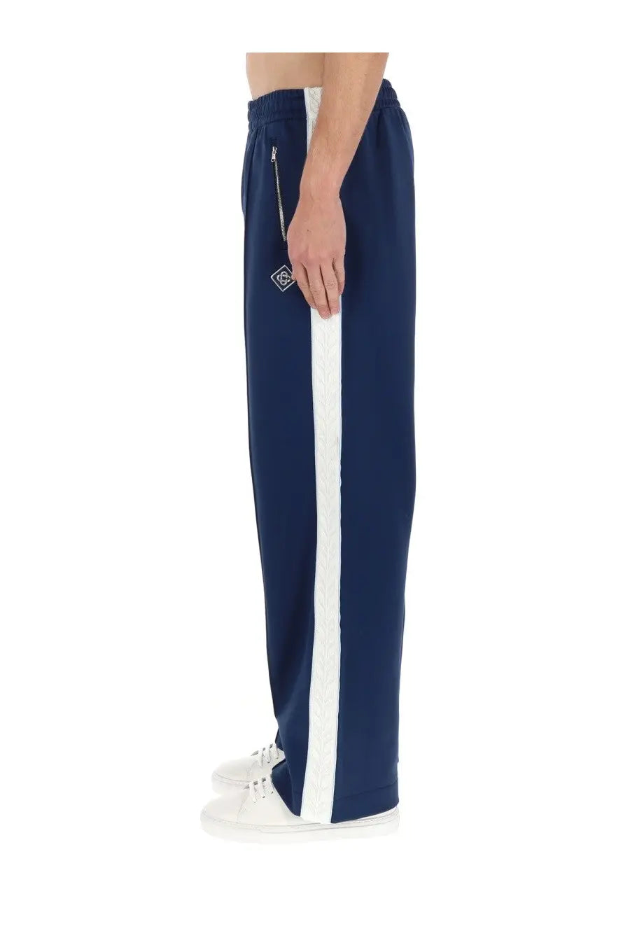 Casablanca men’s navy blue track pants with bold white vertical stripe and small embroidered logo on the thigh