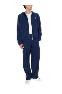 Casablanca men’s navy blue zip-up hoodie with white side stripes and diamond-shaped chest logo for casual wear
