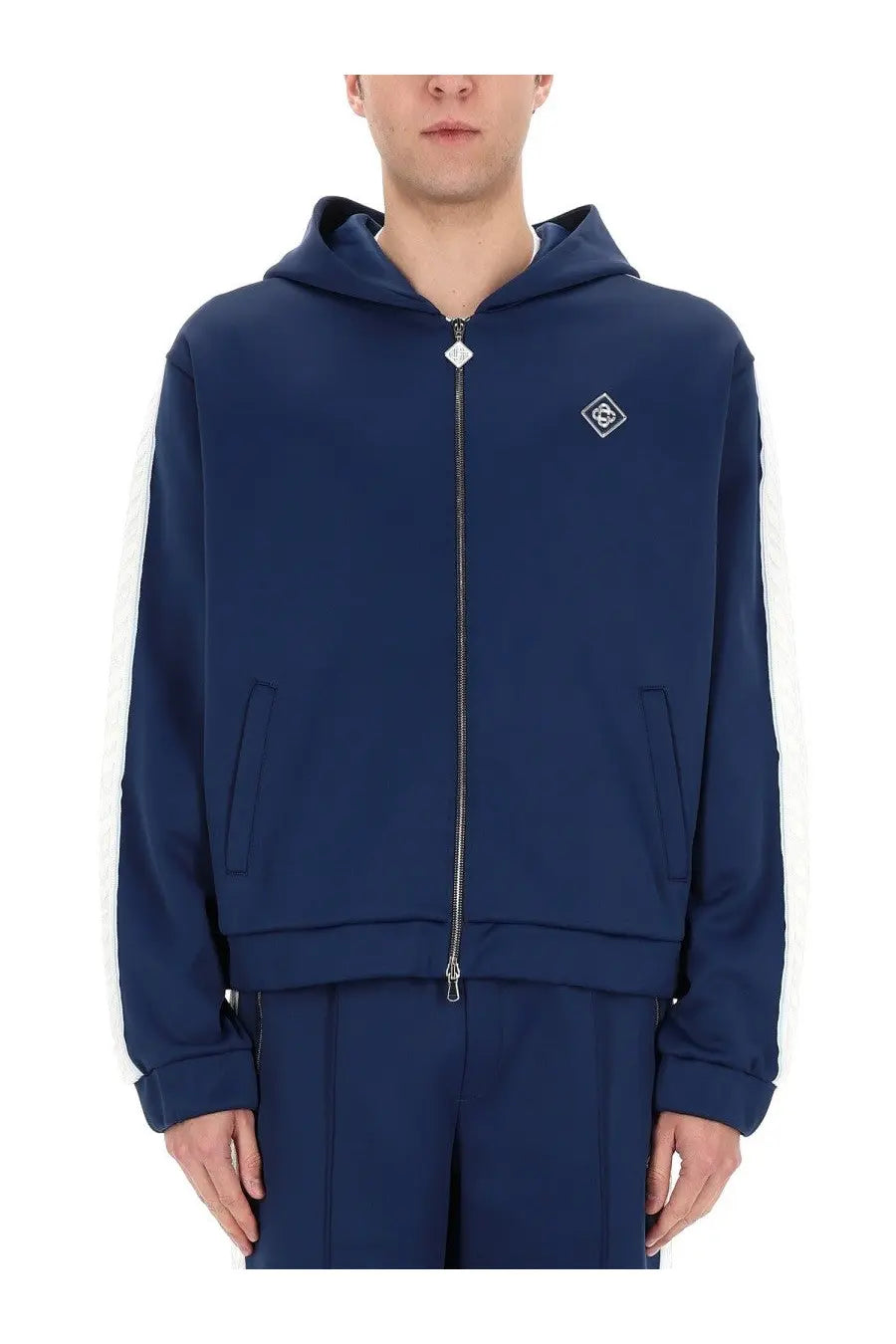 Casablanca men’s navy blue zip-up hoodie with white side stripes and diamond-shaped logo on chest
