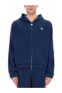 Casablanca men’s navy blue zip-up hoodie with white side stripes and diamond-shaped logo on chest