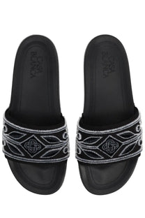 Casablanca unisex slide black sandals with a decorative white embroidered band featuring geometric and leaf patterns