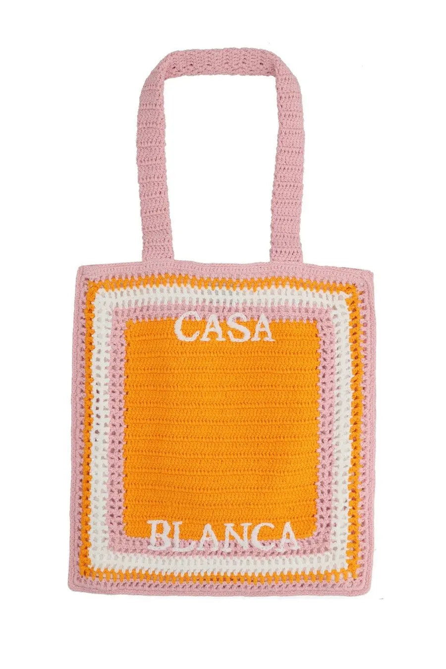 A pastel pink and orange crocheted unisex tote bag embroidered with Casa Blanca in white lettering