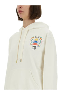 Cream-colored Casablanca women’s Casaway mountain sweatshirt with hood and colorful embroidered mountain and fruit patch
