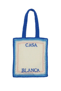 Casablanca women’s crochet tote bag in vibrant blue cream and pink with embroidered casa blanca on front