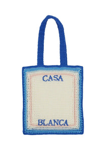 Casablanca women’s crochet tote bag in vibrant blue cream and soft pink with casa blanca embroidered front