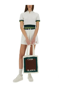 White and green crocheted tote bag with casa blanca cream embroidery on brown panel for casual use