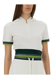 Casablanca women’s cropped tennis shirt white with textured knit hoodie top and green black striped trim and logo waistband