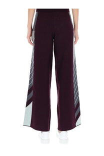 Casablanca women’s purple mauve wide-leg tennis pants with gray and light blue diagonal striped side panels
