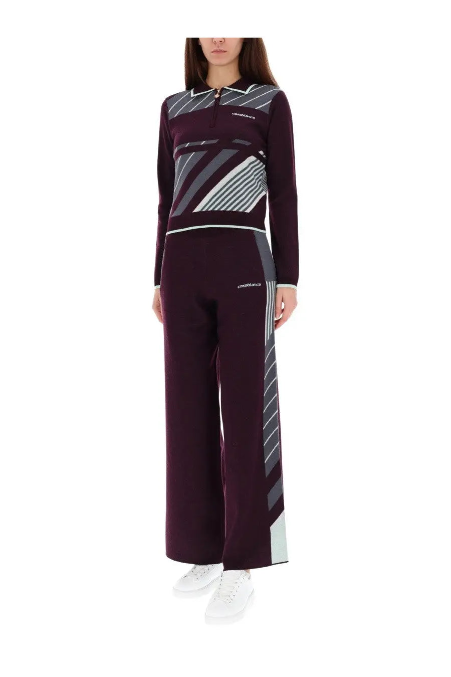 A maroon and gray geometric patterned long sleeve top with quarter zip collar paired with matching wide leg pants