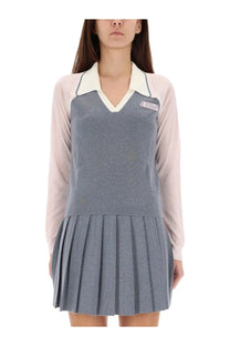 Casablanca women’s long sleeve tennis polo shirt in silver with gray pleated skirt dress featuring white collar and beige sleeves