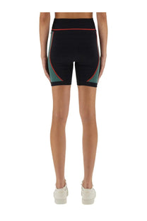 Casablanca women’s seamless black high-waisted cycling shorts with teal side panels and red trim for sportswear