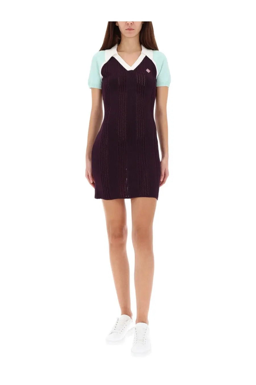 Casablanca women’s tennis dress in dark purple knit with light blue sleeves and white v-neck collar with ribbed texture