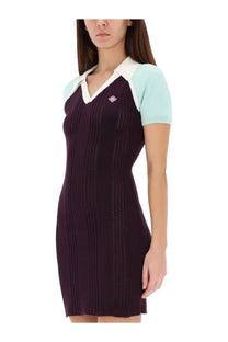 Casablanca women’s tennis dress in deep purple knit with vertical ribbed texture light blue shoulder panel and white collar
