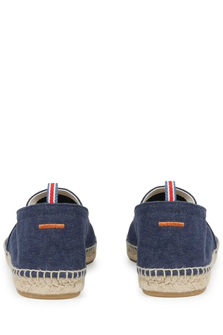 Navy blue canvas espadrille slip-on shoes with woven jute sole and orange stitching from castañer men’s espadrilla pablo blue