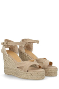 Castañer women’s espadrille Bruna beige sandals with woven rope wedge soles and fabric straps shown from the back