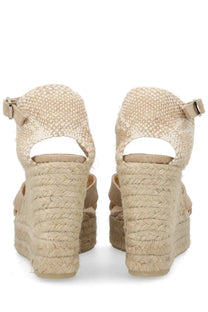 Beige woven espadrille wedge sandals with braided rope heel and adjustable ankle strap by Castañer women’s Bruna