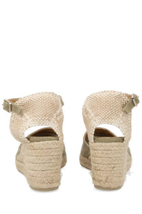 Beige woven espadrille wedge sandals with braided rope heel and adjustable ankle strap by castañer women’s carol green