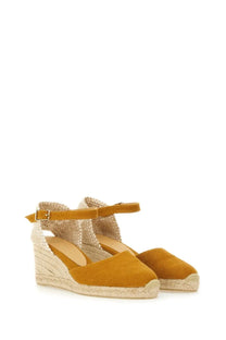 Mustard-colored suede espadrille wedge sandals with woven jute heel and ankle strap by castañer women’s carol orange
