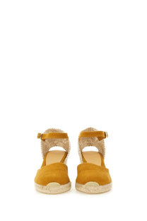 Mustard yellow suede espadrille wedge sandals with woven jute straps and ankle buckles by castañer women