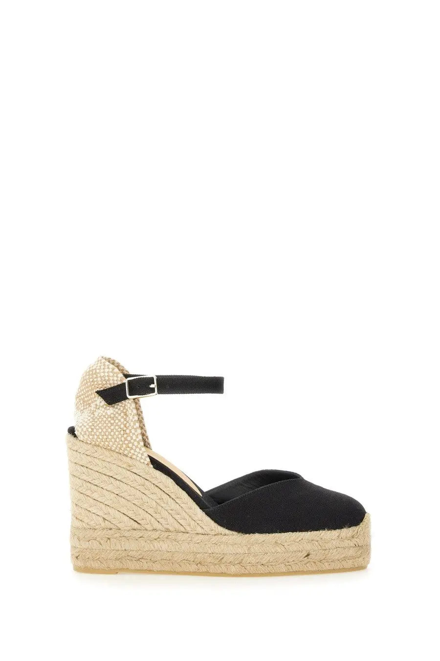 Castañer women’s black espadrille wedge sandal with woven jute sole and ankle strap shown from the back side
