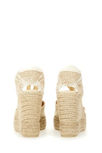 Beige woven espadrille wedge sandals with braided rope heel open back by castañer women’s espadrille clear white