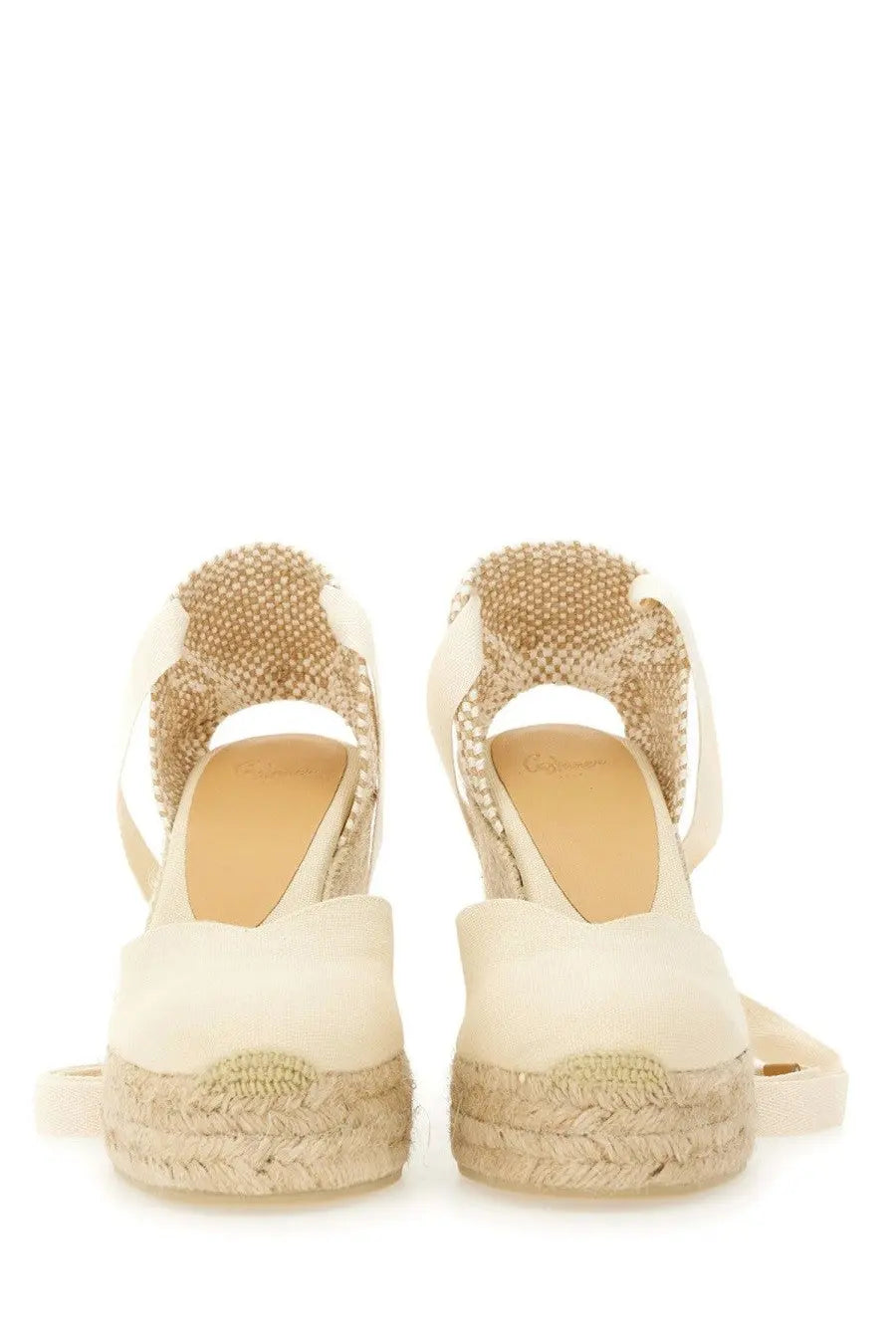 Cream-colored Castañer women’s espadrille wedge sandals with woven jute straps and braided rope heel
