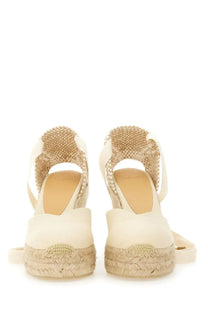 Cream-colored Castañer women’s espadrille wedge sandals with woven jute straps and braided rope heel