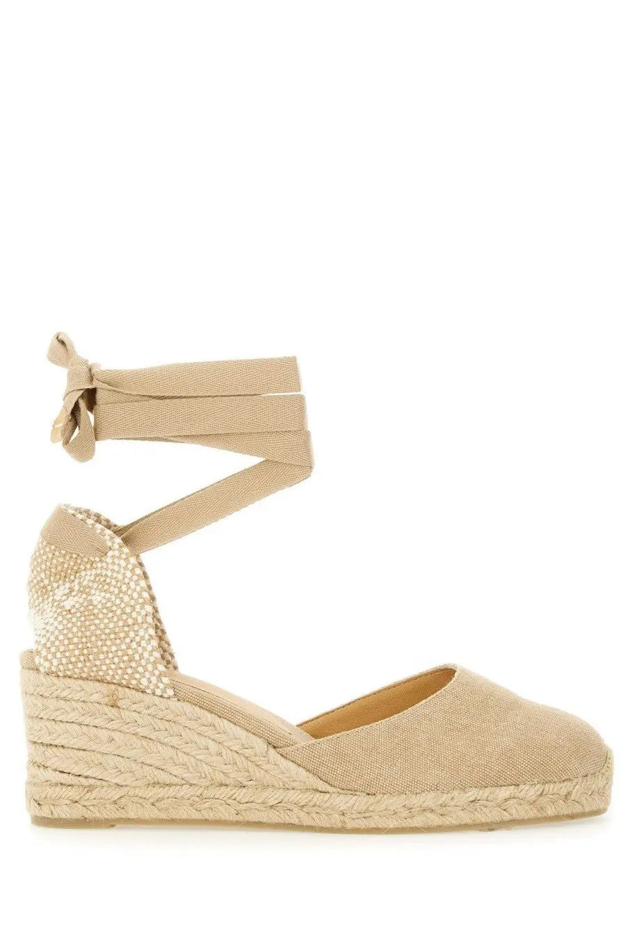 Castañer women’s espadrille wedge sandal in beige with woven jute sole and fabric straps tied in a bow