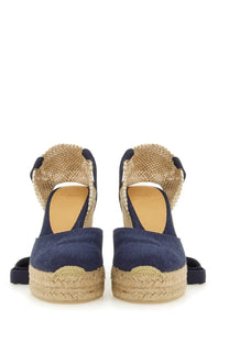 Navy blue canvas espadrille wedge sandals with woven jute soles and ankle straps from castañer for women